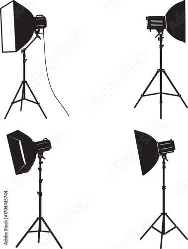 Four studio lighting equipment silhouettes on white background silhouette