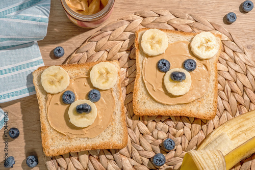 Two slices of bread with peanut butter and bananas on them