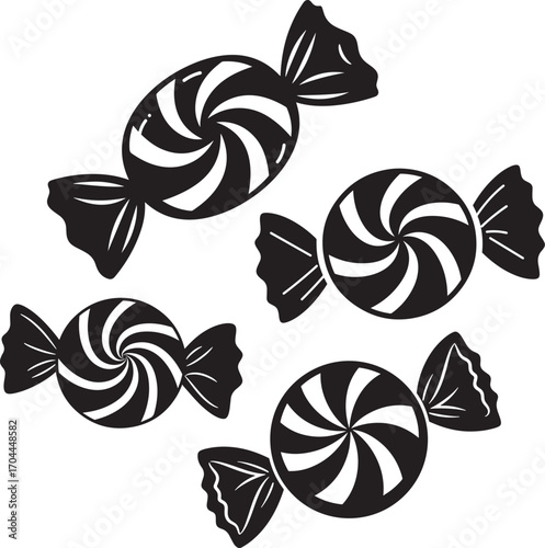 Four swirled round candies wrapped in twisted paper silhouette