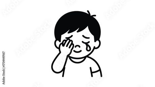 Little boy wiping away tears, feeling sad and overwhelmed with emotion in minimalist black and white