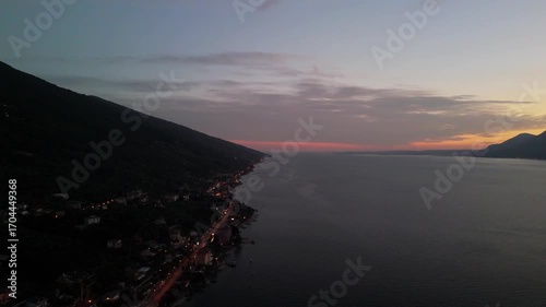 Aerial Sunset Over Lake Garda: Drone Flight from Porto di Brenzone, Brenzone sul Garda, Italy