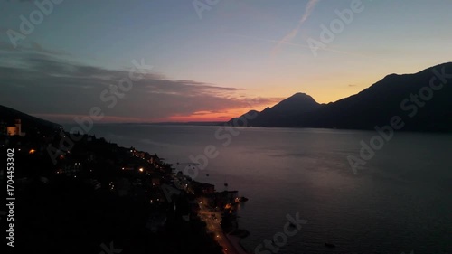 Aerial Sunset Over Lake Garda: Drone Flight from Porto di Brenzone, Brenzone sul Garda, Italy