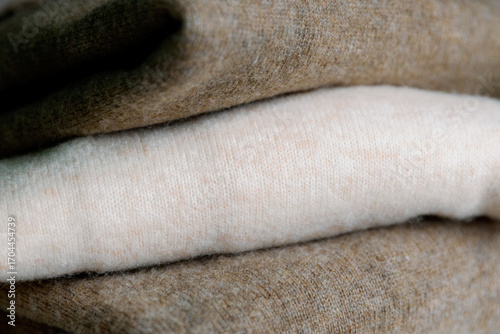 Three pieces of stacked cashmere sweaters.
