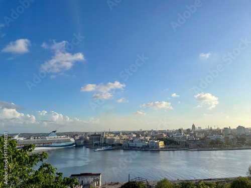 Wallpaper Mural Large cruise ship docked in Havana Harbor, Cuba. City skyline and Capitol building in warm sunset light Torontodigital.ca