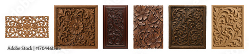 Ornate carved wood panel set including floral, leaf, and scroll patterns in various brown tones isolated. Decorative architectural elements.