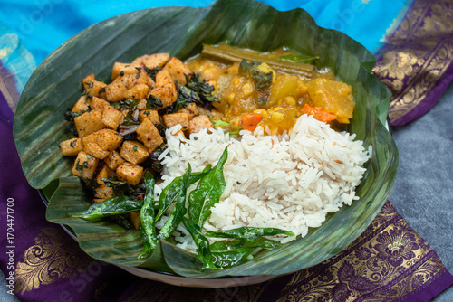 South Indian vegan thali- rice, airfried rutabaga and kale curry, sambar, pickles.