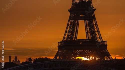 Eiffel Tower sunrise timelapse with boats on Seine river and in Paris, France.