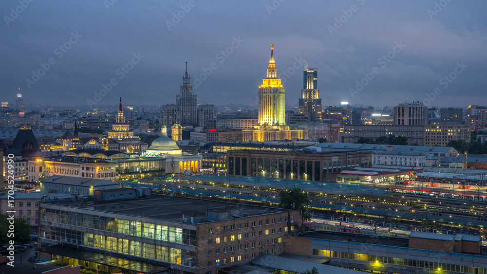 Fototapeta premium Evening top view of three railway stations day to night timelapse at the Komsomolskaya square in Moscow, Russia