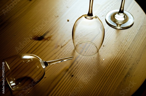 The quiet aftermath of a delightful meal: an empty dining table with lingering crumbs and wine glasses, hinting at a perfectly enjoyed feast.