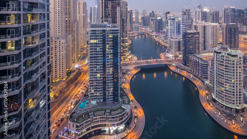 Beautiful aerial top view day to night transition timelapse of Dubai Marina canal