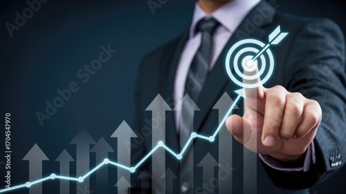 Professional businessman achieving success by targeting growth goals with upward financial charts