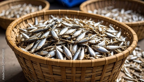 Fresh small fish in a woven basket