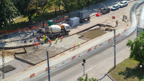 Road construction site with tram tracks repair and maintenance aerial timelapse.