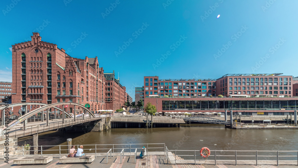 Naklejka premium Panorama showing famous old Speicherstadt in Hamburg timelapse featuring the International Maritime Museum, Germany