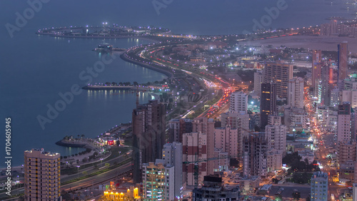 Wallpaper Mural Skyline with Skyscrapers day to night timelapse in Kuwait City downtown illuminated at dusk. Kuwait City, Middle East Torontodigital.ca
