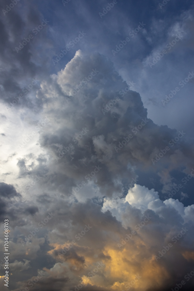 Fototapeta premium Dramatic storm clouds before a thunder-storm at sunset.