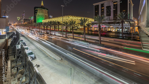 Aerial day to night timelapse of King Fahd Road near the illuminated Riyadh National Library in Riyadh, Saudi Arabia.