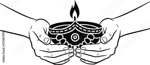 Hands gently hold a decorative diya, symbolizing light, hope, and celebration