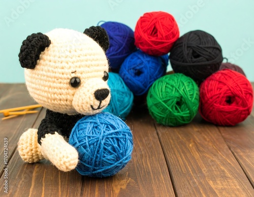Crochet teddy bear with yarn balls