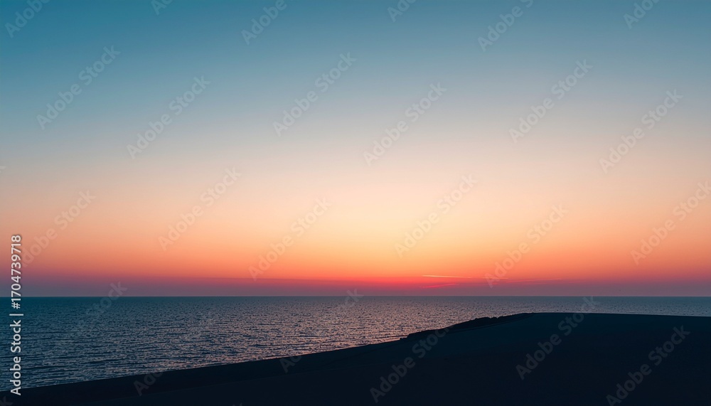 Obraz premium Serene Coastal Sunset with Ocean and Dunes