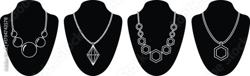 Elegant silver necklaces displayed on black velvet busts, showcasing modern geometric designs.
