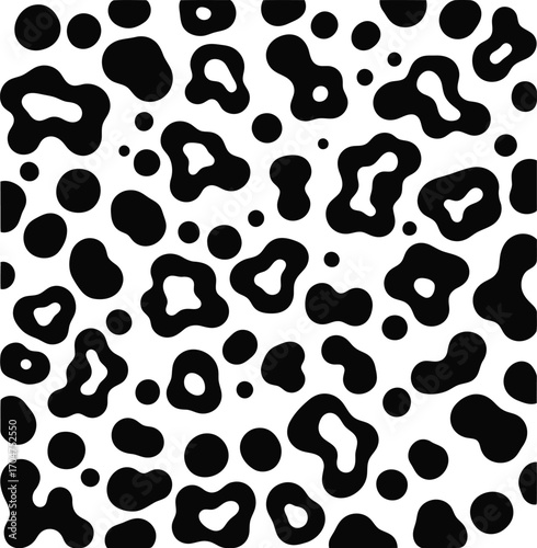 Abstract black and white leopard print pattern with irregular shapes and spots on a white background