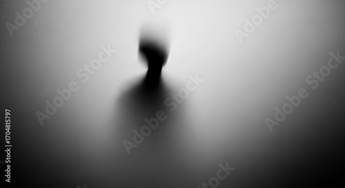 A mysterious silhouette shrouded in mist, evoking a suspenseful atmosphere.