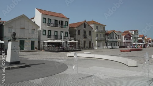 famous colorful striped houses along the promenade of the fisherman village of Costa Nova along the coastline of the atlantic ocean in Portugal.