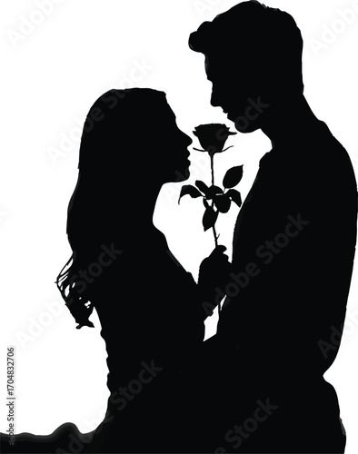 Silhouette of a couple sharing a rose at sunset