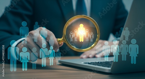 Professional magnifying glass highlights key team member amidst diverse workforce for recruitment success
