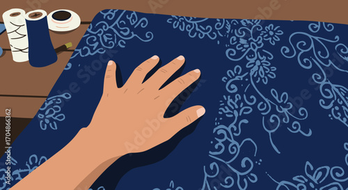 A skilled artisan's hand gently explores the intricate, traditional patterns on a rich indigo-dyed fabric, celebrating the detailed beauty of handmade textile art.