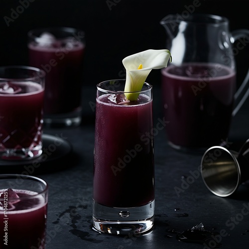 Wallpaper Mural A bold, dark violet cocktail with a single calla lily garnish,  The drink is in a tall, slender glass with a dark, almost black hue. The white calla lily provides a striking contrast. Torontodigital.ca