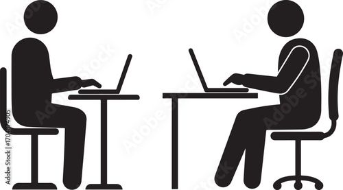 Two people working on laptops at desks silhouette