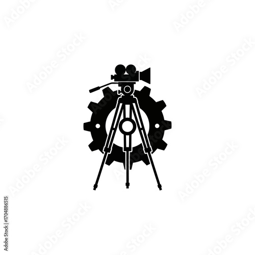 Silhouette of a movie camera on a tripod, enclosed by a gear, suggesting cinematic production.