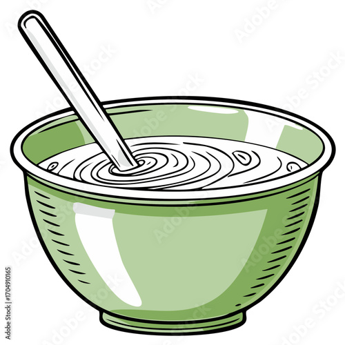 White spoon in a light green bowl of creamy white mixture with concentric ripples