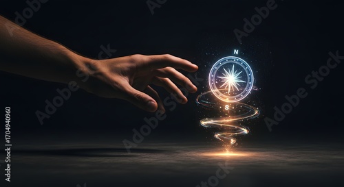 A male hand catching glowing holographic compass, symbol of guidance.