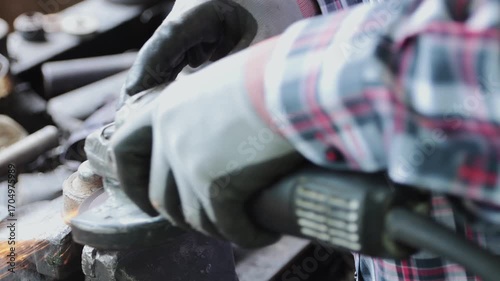 Track Shot Zoom Back View Construction Industrial Factory or Metalwork Concept by Mechanic or Technician Using Grinder with Auto Part Workshop