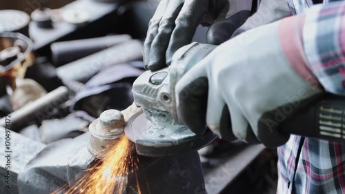 Zoom Back View Construction Industrial Factory or Metalwork Concept by Mechanic or Technician Using Grinder with Auto Part Workshop