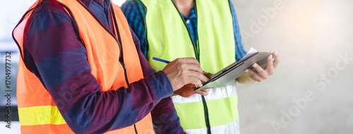 Tableau sur toile two architect look at document and planning to renovation room