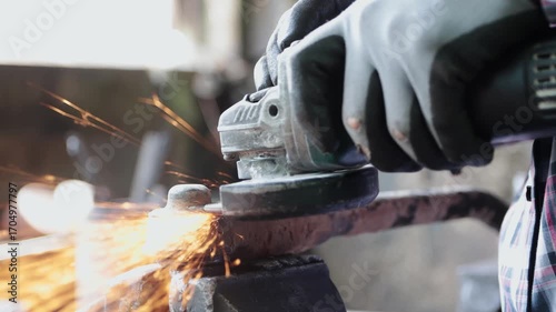 Zoom View Construction Industrial Factory or Metalwork Concept by Mechanic or Technician Using Grinder with Auto Part Workshop