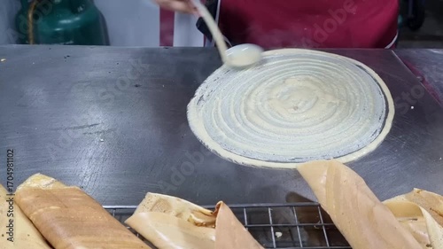Business marketing, Street food in Thailand are making Thai dessert pancake crispy roll,  snack crape roll or Tokyo dessert. industry, food business, food industrial, food industry, menu, menu design