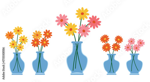 colorful flowers arranged in blue vases on white background