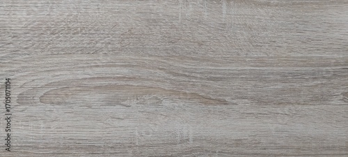 Wood texture in shades of light grey and brown, featuring natural grain patterns and subtle lines throughout the surface, creating an organic design. No visible text or marks present