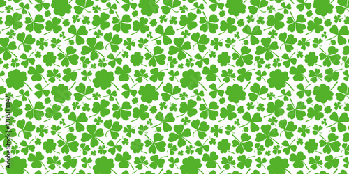 Shamrock or clover leaf horizontal green seamless pattern with falling leaves on a white background vector illustration. Irish holiday celtic St Patrick day motif seamless pattern shamrock clover leaf