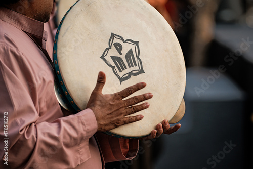 Traditional drum held by musician during performance