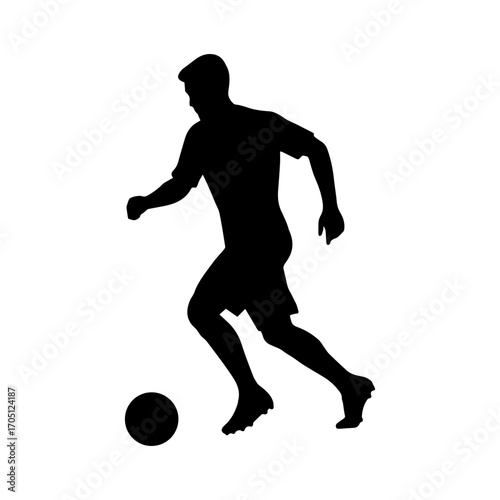 Silhouette of a soccer player dribbling a ball