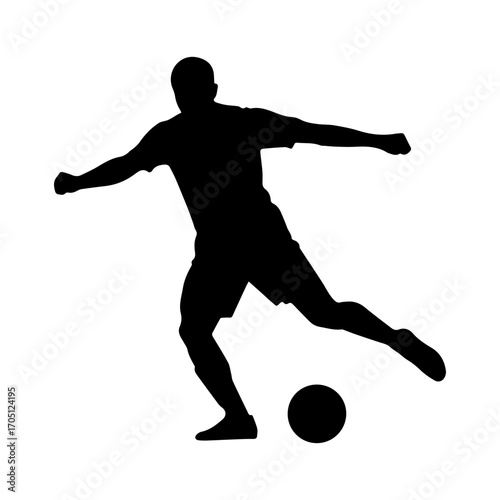 Silhouette of a soccer player kicking a ball