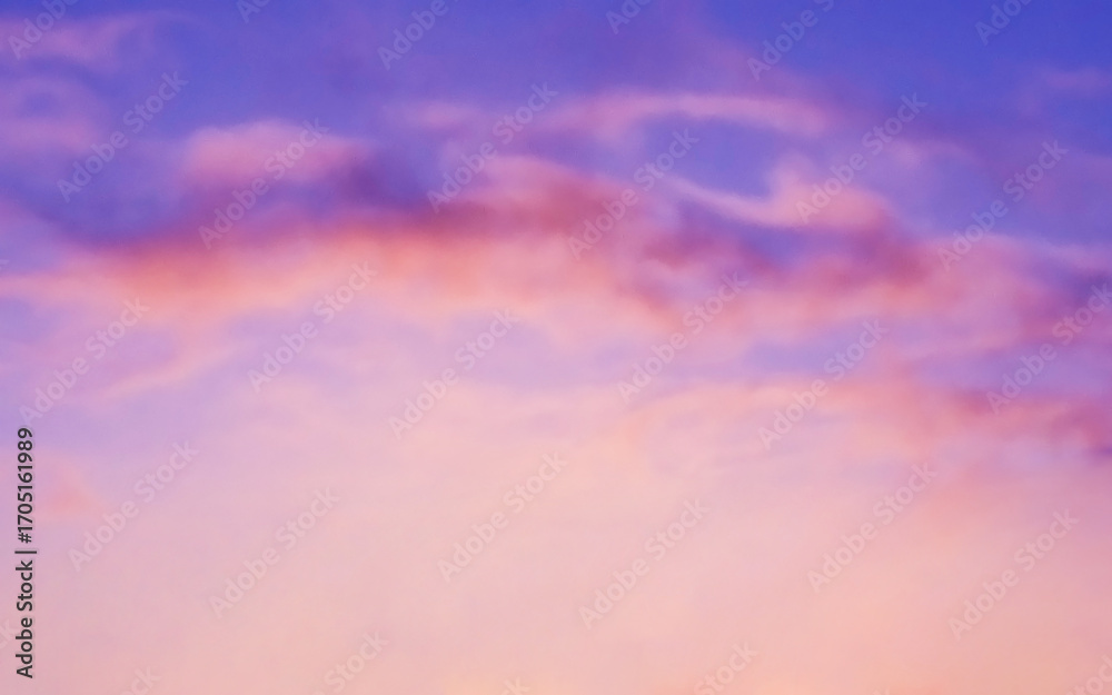 Obraz premium Purple golden yellow orange sky and white cumulus cloud. Sunset sunrise cloudscape sky.