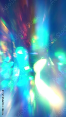 The crystal prism shimmered with a holographic shine, casting blue glare and a blurry rainbow overlay of light