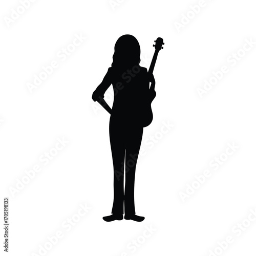 Silhouette of a guitar player, standing back with guitar over shoulder